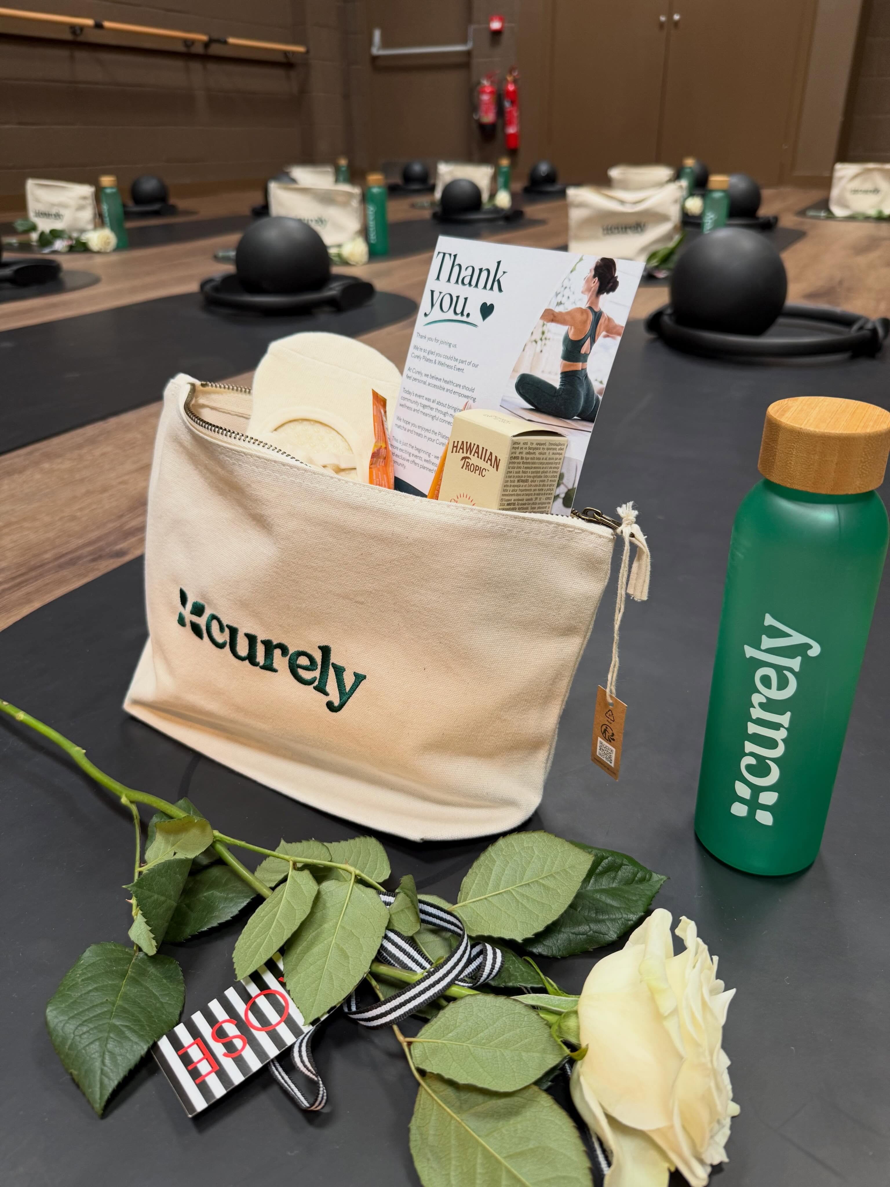 Curely event gift bag and rose